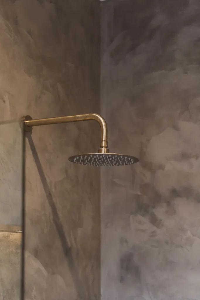 Microcement shower finish in San Diego — grout-free wet area by Evergreen